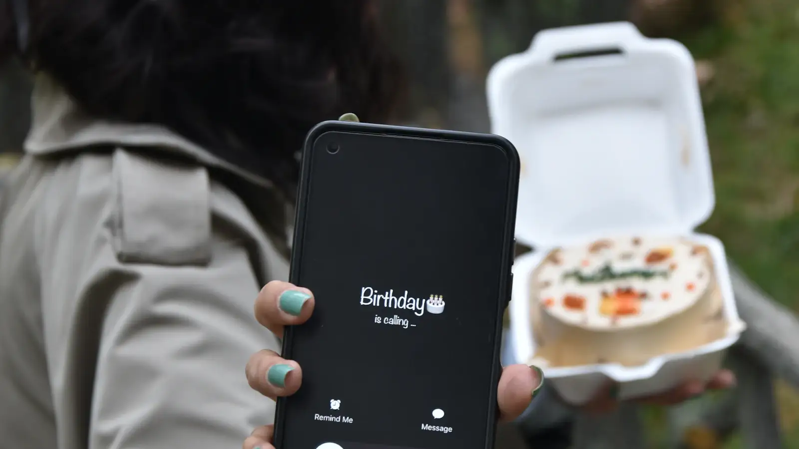 Food delivery packaging with a smartphone showing ordering app